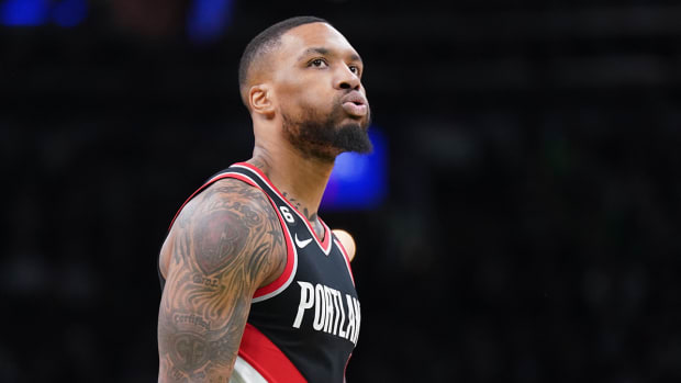 Trail Blazers guard Damian Lillard (0) reacts during a break in the action against the Celtics in the second quarter at TD Garden.